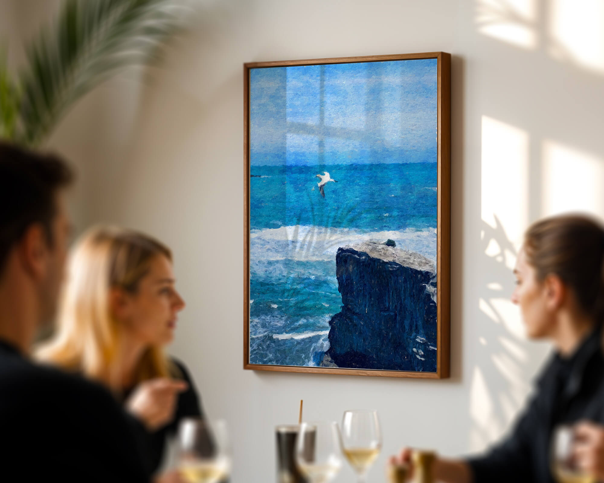 Seascape with soaring seagull over rocky cliff and ocean waves