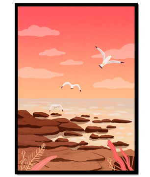 Seagulls flying over rocky coastline at sunset