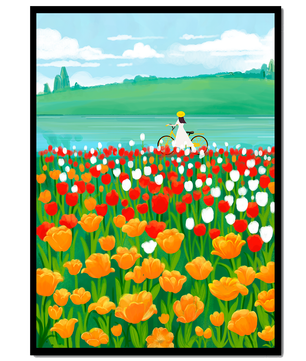 Woman with bicycle in vibrant tulip field by a lake
