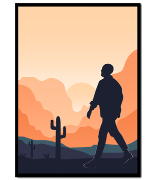 Silhouetted figure walking in desert landscape at sunset