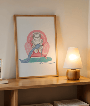 Cozy knitting cat relaxing in an armchair with a warm scarf - Mi tienda
