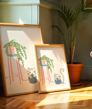 Cat Playing with Yarn Beside a Potted Plant on Pink Stool - Mi tienda
