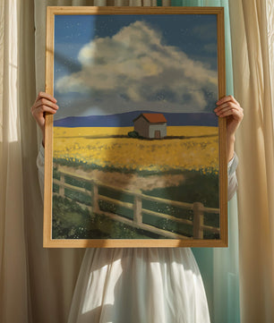 Idyllic rural scene with house and yellow field under blue sky