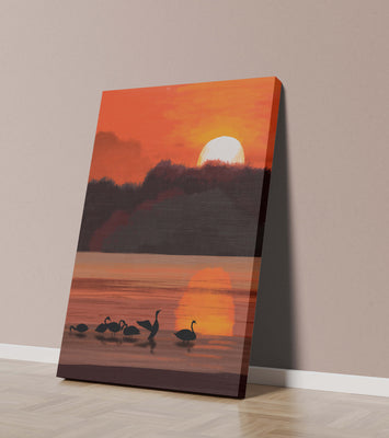 Serene sunset over a lake with silhouetted swans
