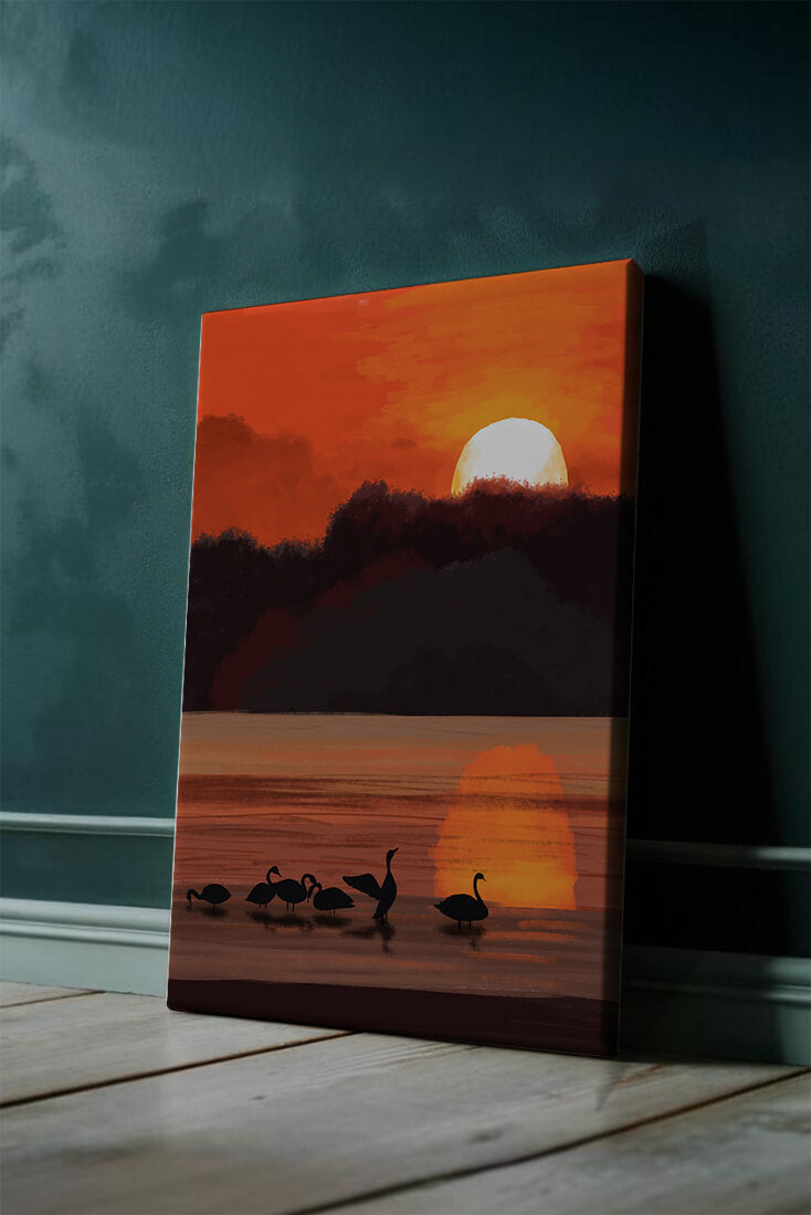 Serene sunset over a lake with silhouetted swans