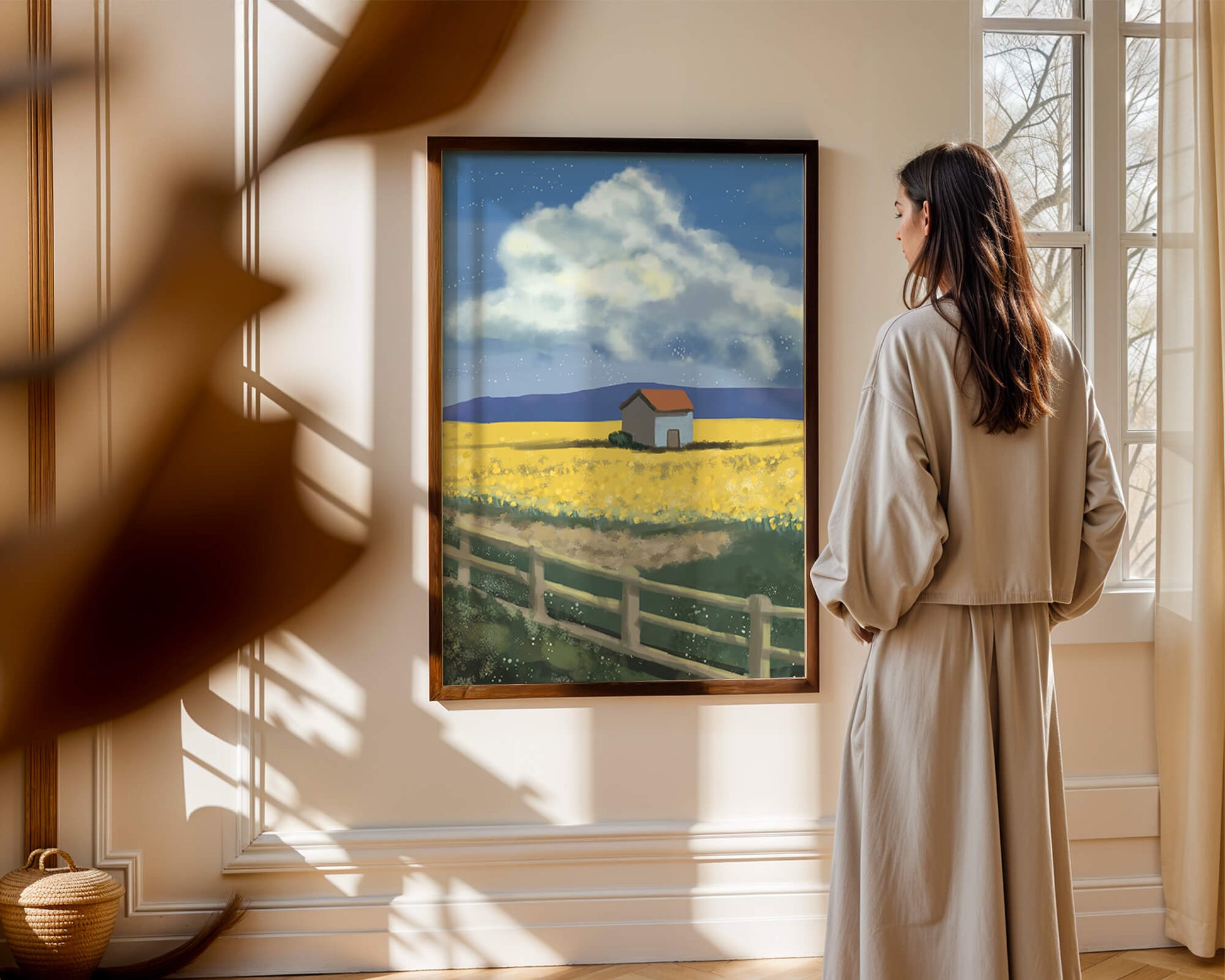 Idyllic rural scene with house and yellow field under blue sky