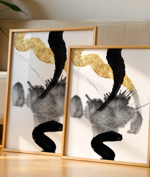 Abstract black and gold brushstrokes with textured patterns