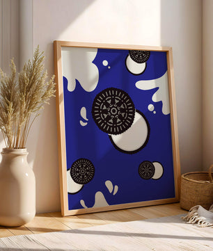 Graphic design featuring cookies and milk splashes on blue background