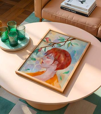 Illustrative artwork of a woman with red hair and floral branch