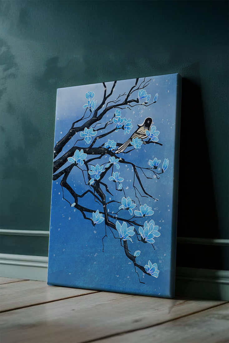 Bird on a branch with blue flowers against a snowy background