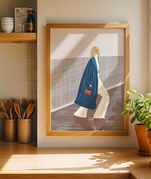 Fashionable Woman in Long Blue Coat Walking Along Corridor with Orange Handbag