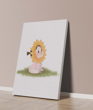 Adorable child with sunflower costume sitting on a grassy patch