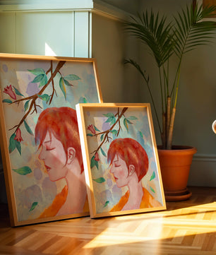 Illustrative artwork of a woman with red hair and floral branch