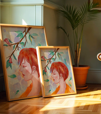 Illustrative artwork of a woman with red hair and floral branch