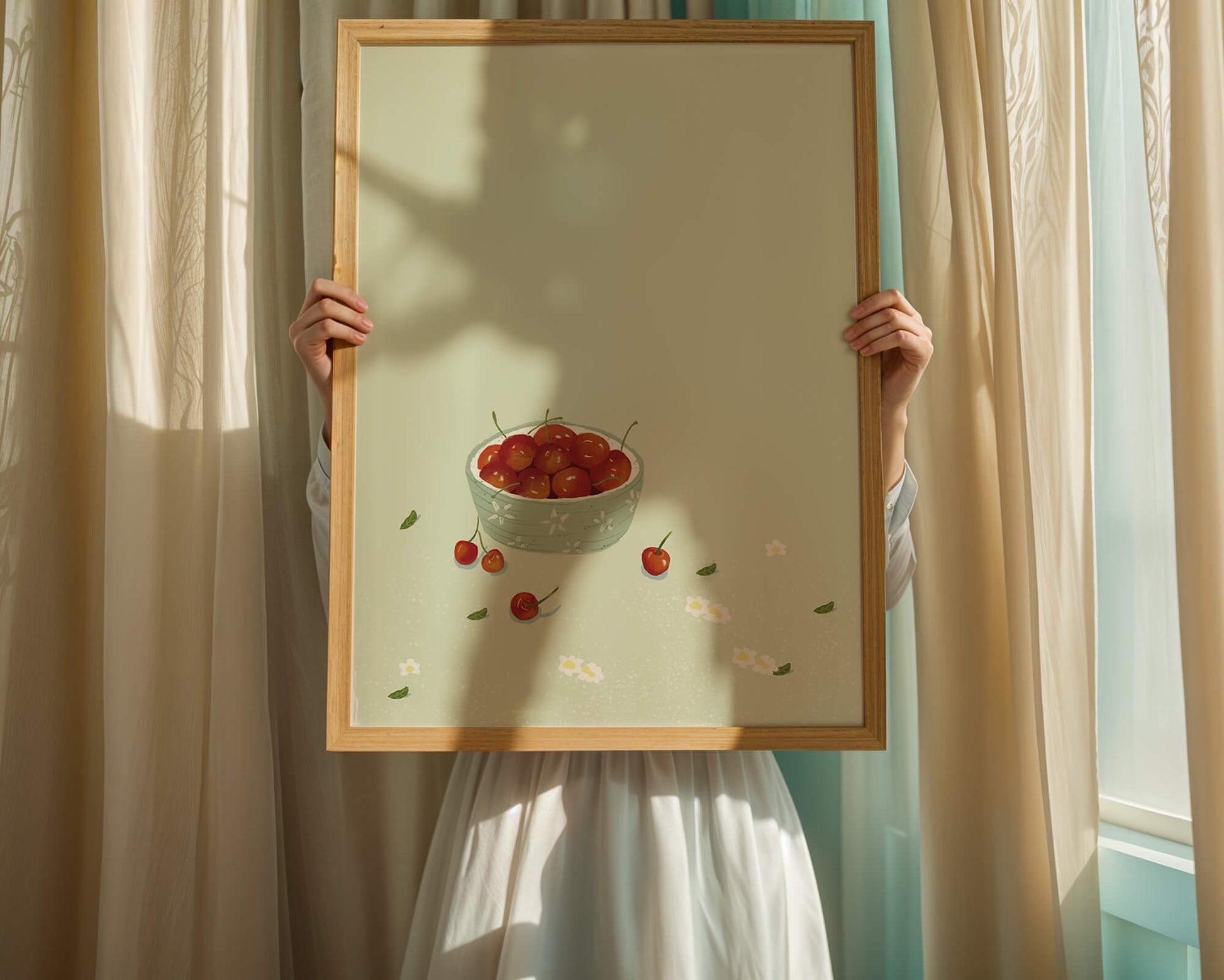 Cherries in a decorative bowl with floral accents on a soft green background