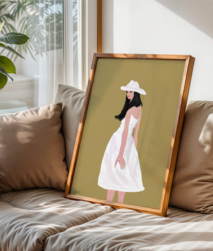 Woman in a white dress and hat on a gold background