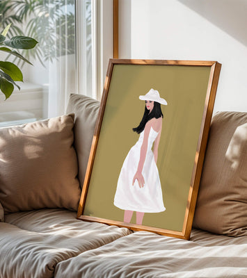 Woman in a white dress and hat on a gold background