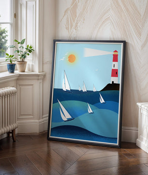Coastal scene with sailboats and lighthouse on a bright sunny day