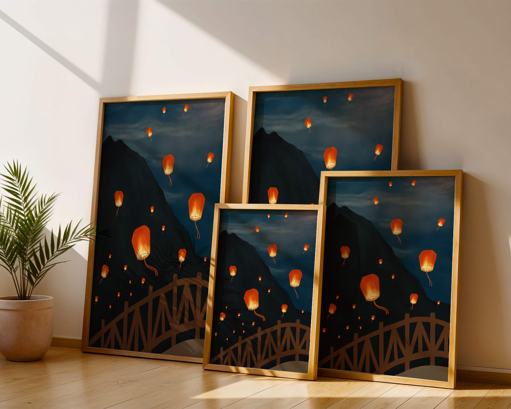 Lanterns floating in the night sky over a mountain landscape