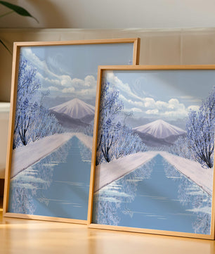 Serene winter landscape with mountain and snowy trees reflecting in water