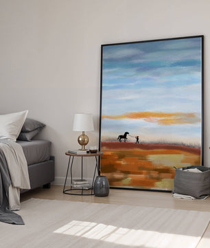Serene landscape with cowboy and horse under vast sky