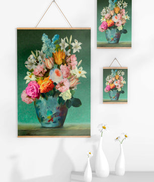 Floral arrangement in a decorative vase on a green background