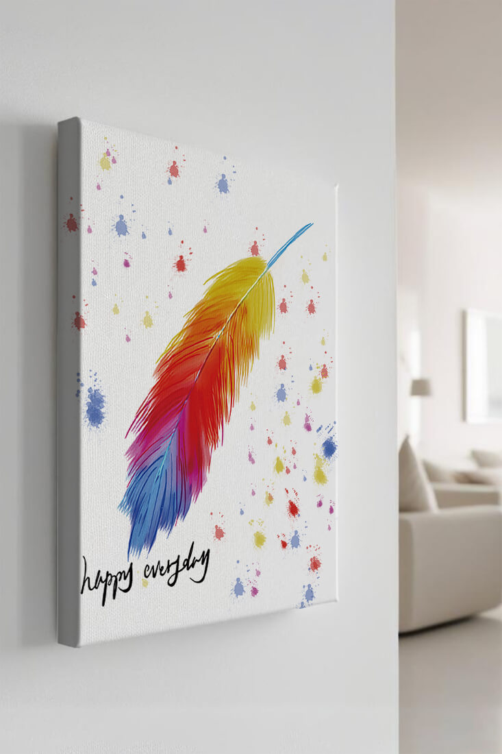 Colorful feather with inspirational message on abstract paint splatter background