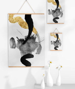 Abstract black and gold brushstrokes with textured patterns