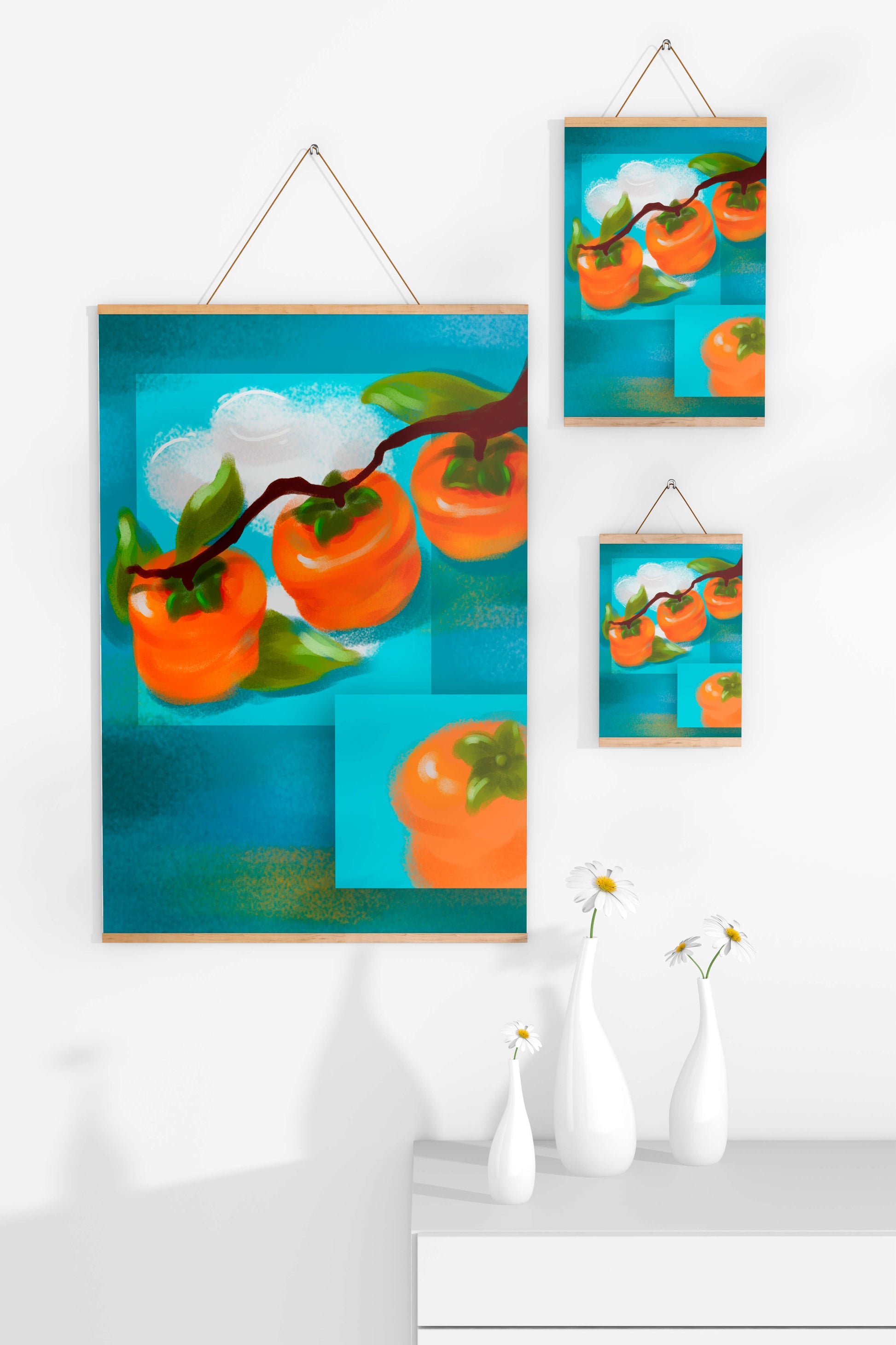 Vibrant persimmons on a branch with a blue background
