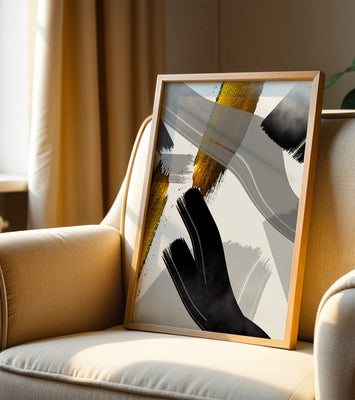 Abstract art piece with gold and black brushstrokes on a gray background