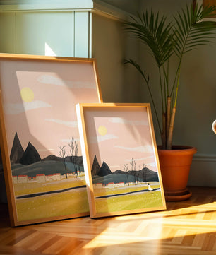 Serene landscape with mountains, village, and a girl under a pink sky