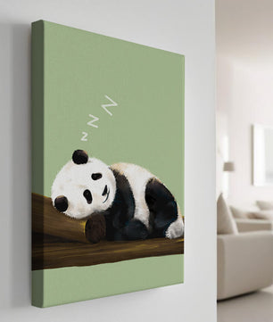 Peaceful panda resting on a log in a serene setting