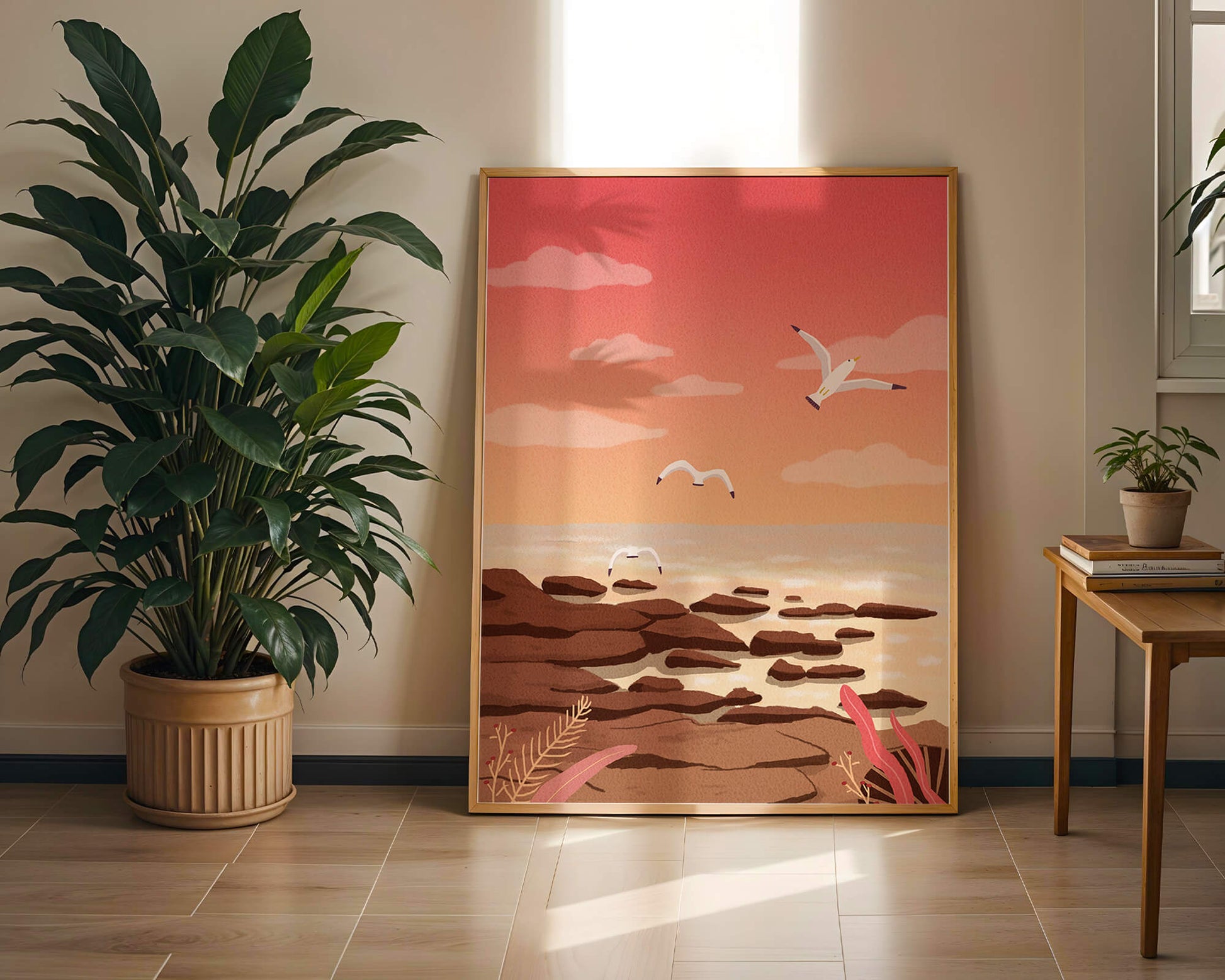 Seagulls flying over rocky coastline at sunset