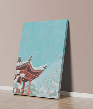 Snow-covered traditional pagoda under a clear blue sky