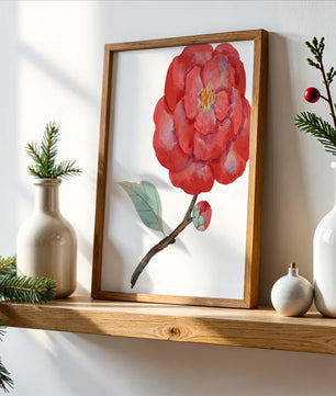 Watercolor illustration of a red camellia flower with green leaves
