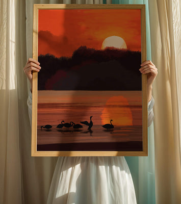 Serene sunset over a lake with silhouetted swans
