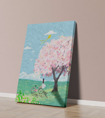 Springtime scene with cherry blossom and girl with bicycle