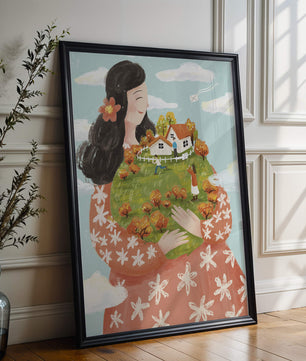 Femme fantaisiste tenant un paysage miniature avec famille et maisons