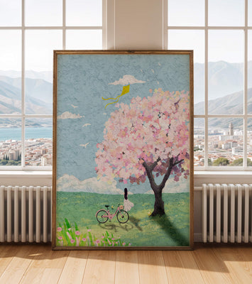 Springtime scene with cherry blossom and girl with bicycle