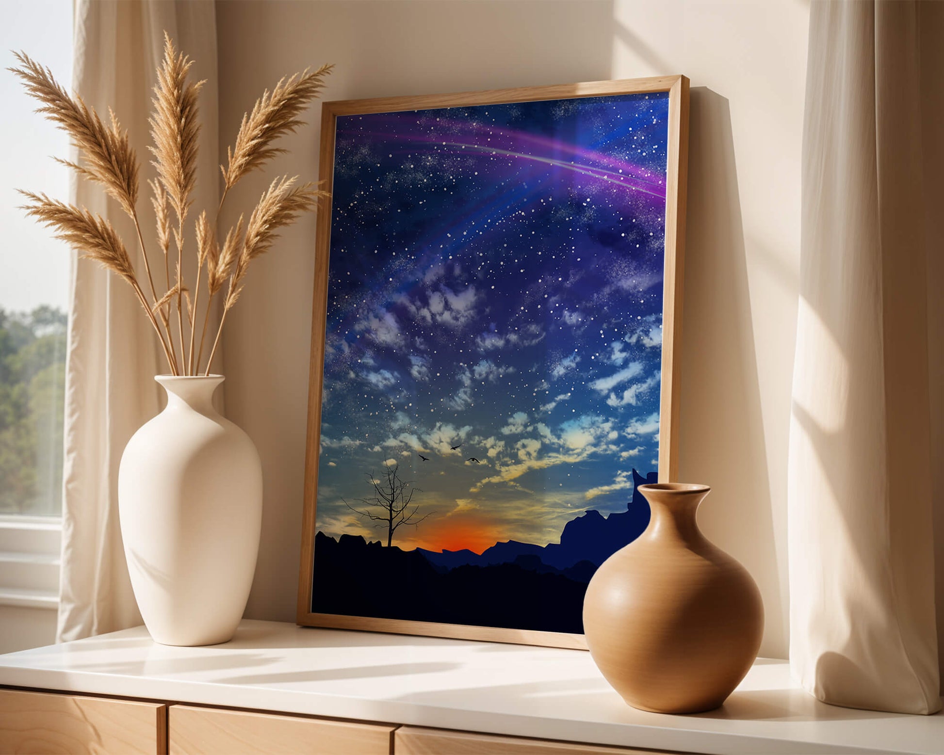 Starlit night sky with colorful sunset and silhouetted landscape