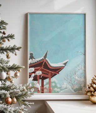 Snow-covered traditional pagoda under a clear blue sky