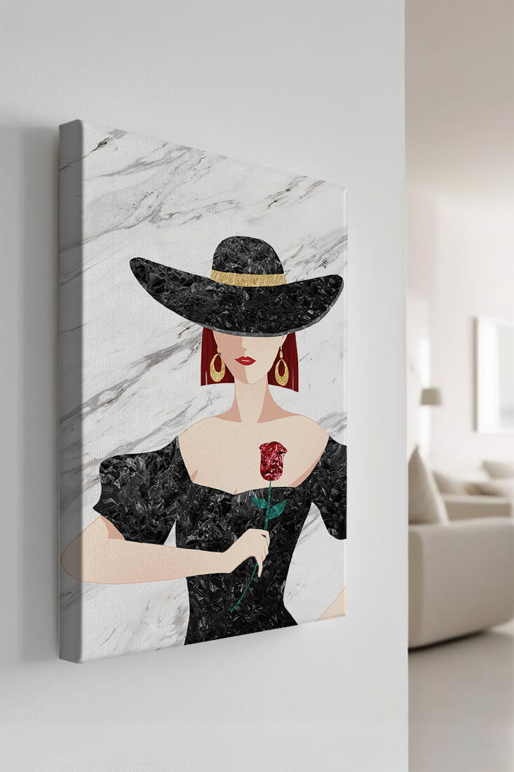 Elegant woman in wide-brimmed hat holding a rose on marble background