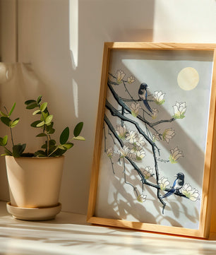 Birds on blossoming branches under a serene moonlit sky