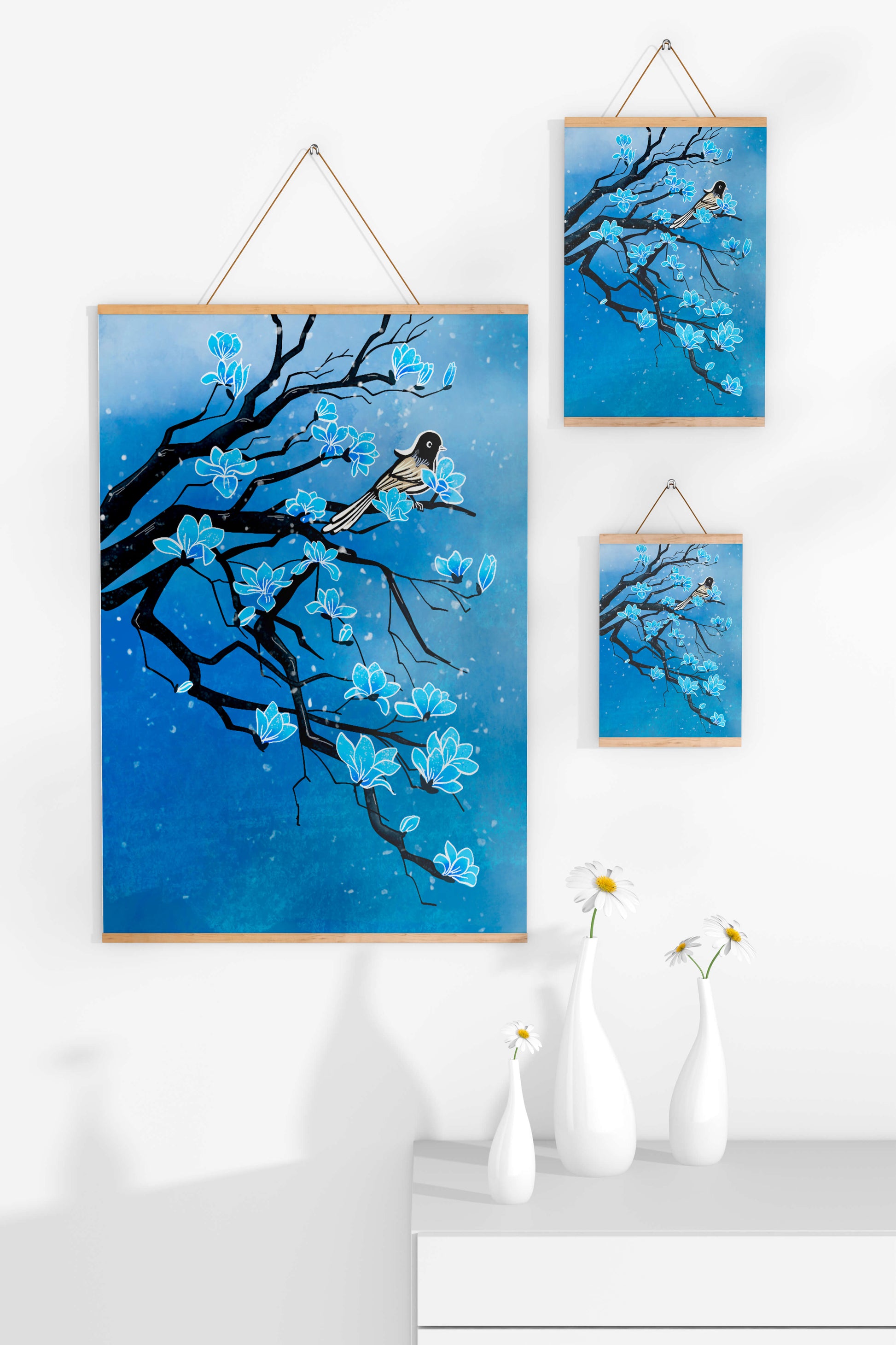 Bird on a branch with blue flowers against a snowy background