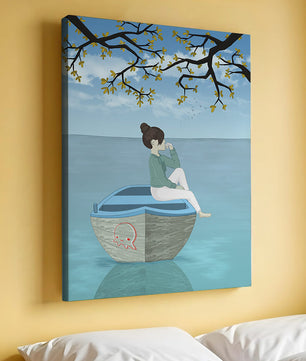 Chica relajándose en un bote bajo un árbol junto al agua