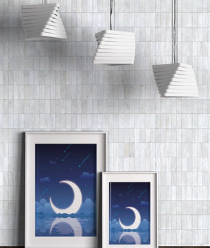 Serene night sky with crescent moon reflecting on water