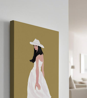 Woman in a white dress and hat on a gold background