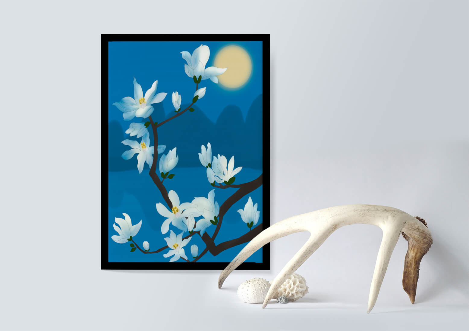 White magnolia branch under moonlight with blue background