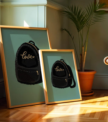 Elegant black backpack with gold accents and love inscription