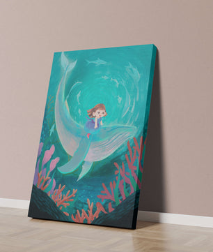 Underwater scene with child and whale surrounded by marine life